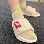 NIKE OFF COURT SLIDES